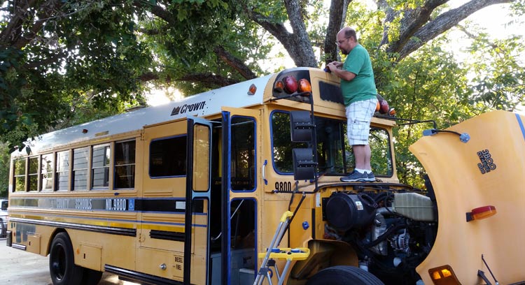 John Bloem working on restoring the school bus